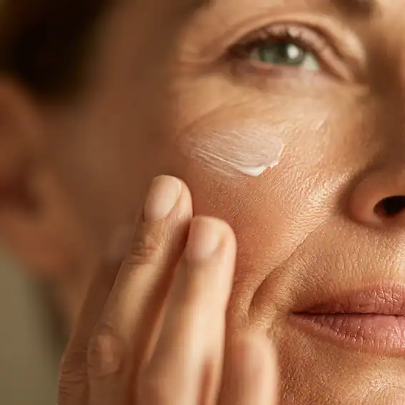 Macro close-up of hydrated cheek skin texture and fine pores, illustrating why skincare order affects absorption